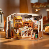 Maqueta de panadería artesanal en madera, papel y tela